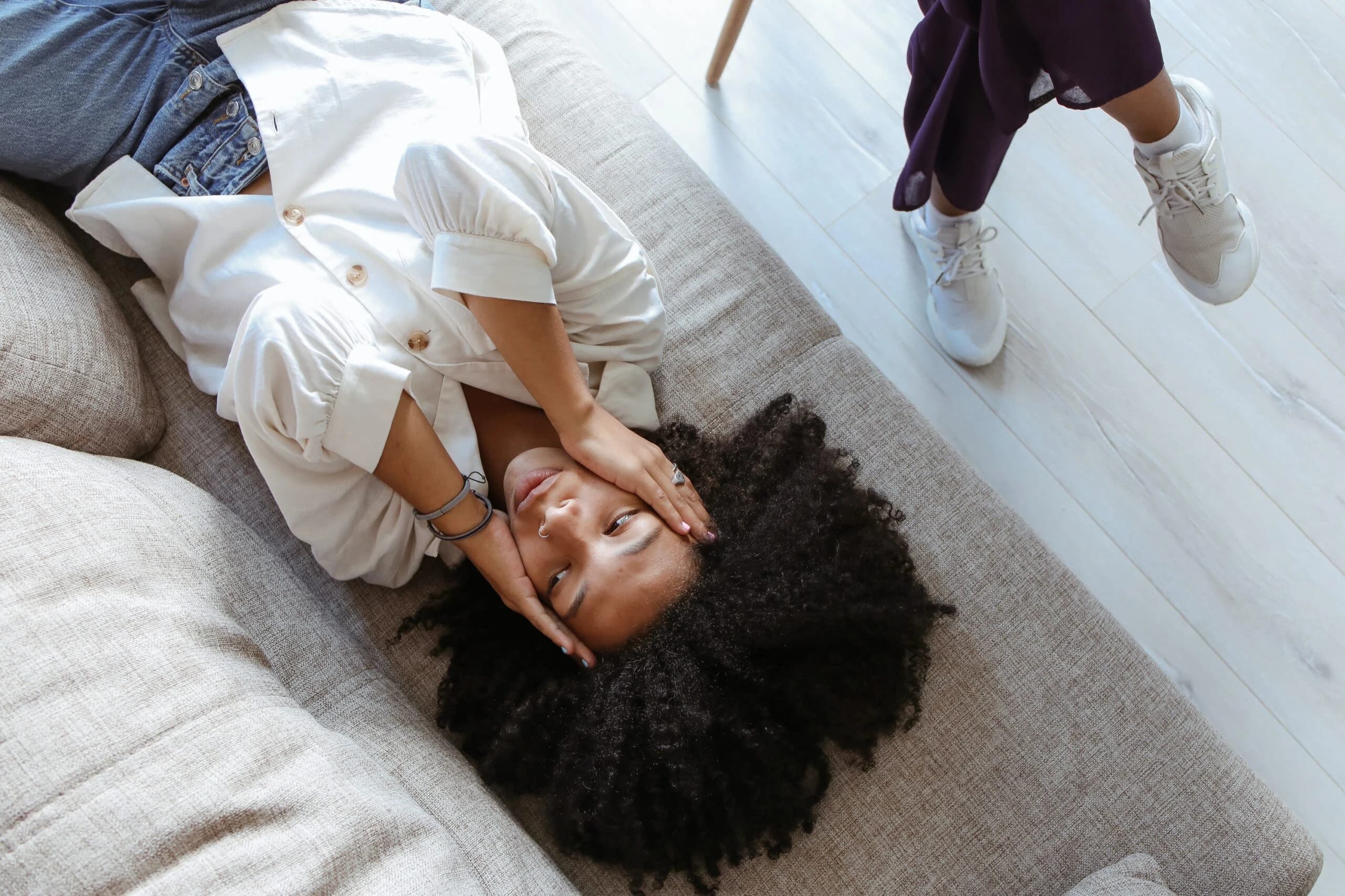 woman lying on couch representing adjustment disorder