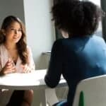 woman talks to therapist
