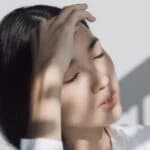 woman has hand on face representing Schizoaffective Disorder